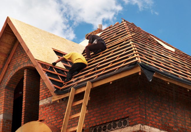Roofing Contractors Installing House Roof Board for Asphalt Shin